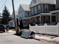 Roses in Front of a White Picket Fence 
by EZ